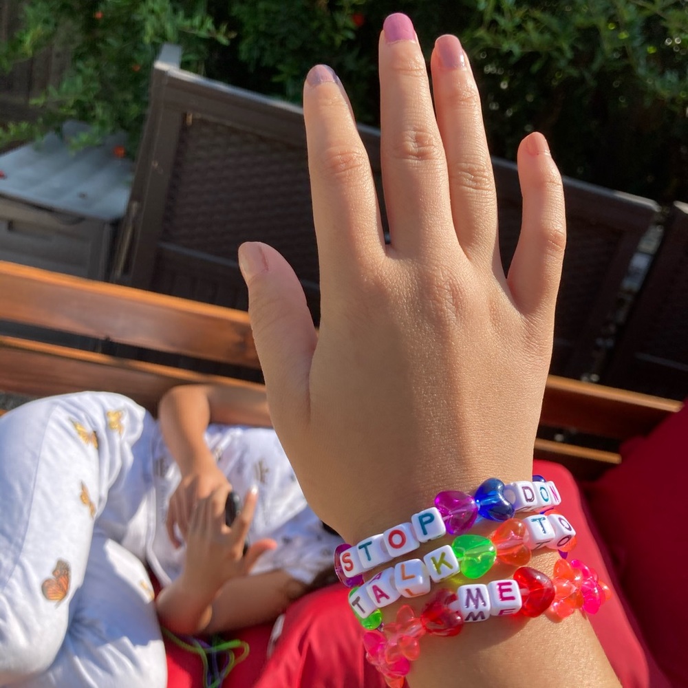 Cute bracelet spelling out “stop don’t talk to me”